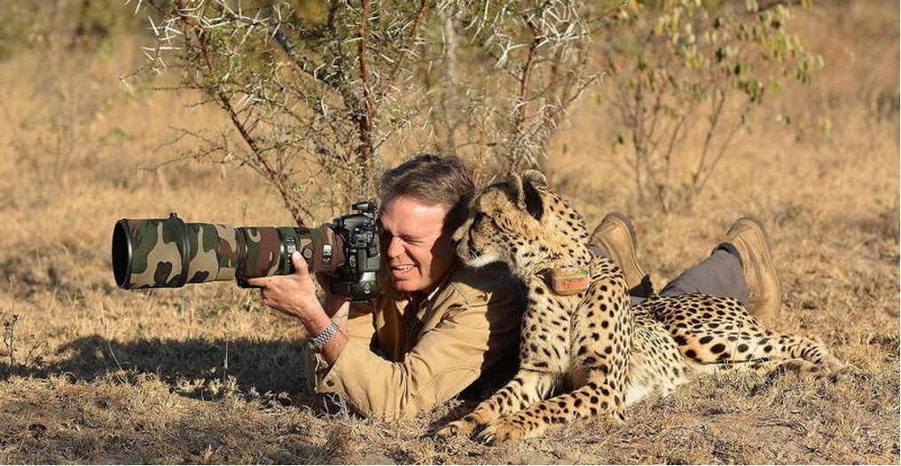 Photographer with a wild animal