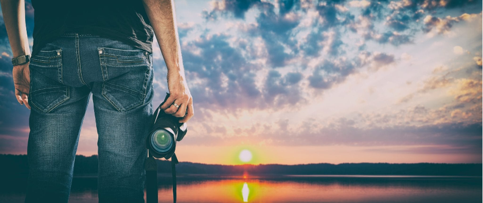 Man Holding the camera and looking at a beautiful view. 